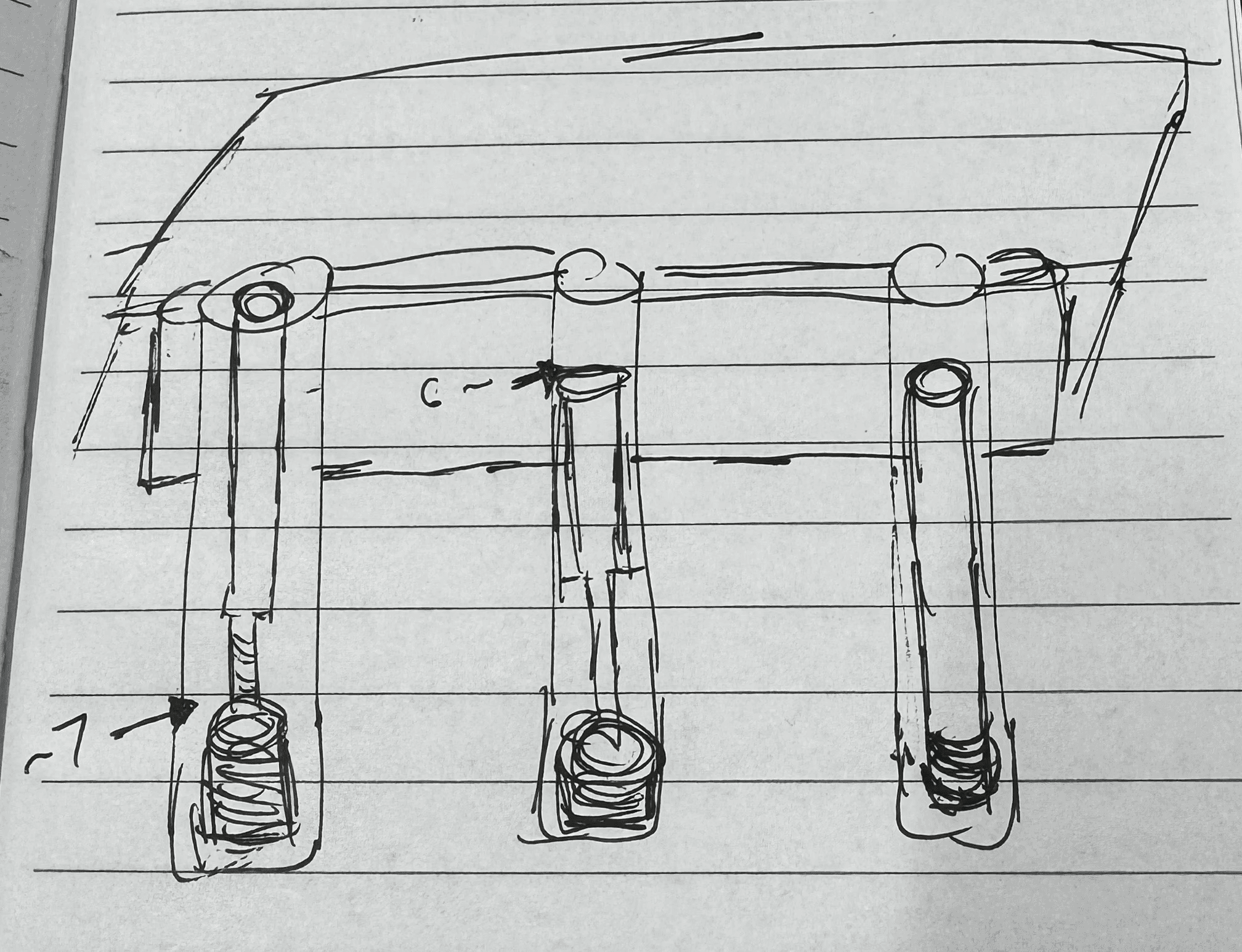 An early sketch of the lift-assist mechanism, three mounting posts with
springs sketched in pen